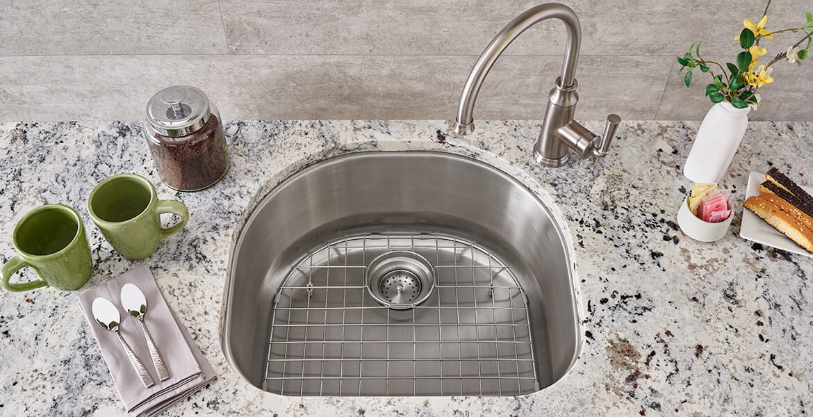 portsmouth kitchen faucet and sink with grid