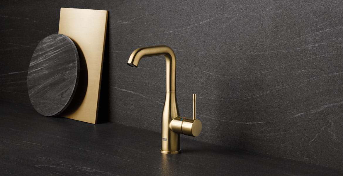 Gold Essence Bathroom Faucet on Black Marble