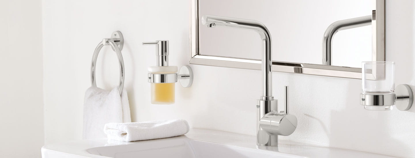 Concetto Single Handle Bathroom Faucet by GROHE in white modern bathroom with mirror