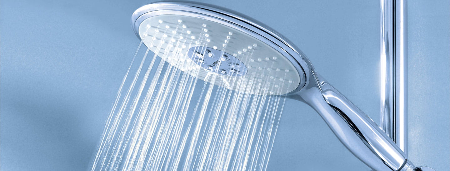 Grohe shower head spraying water.