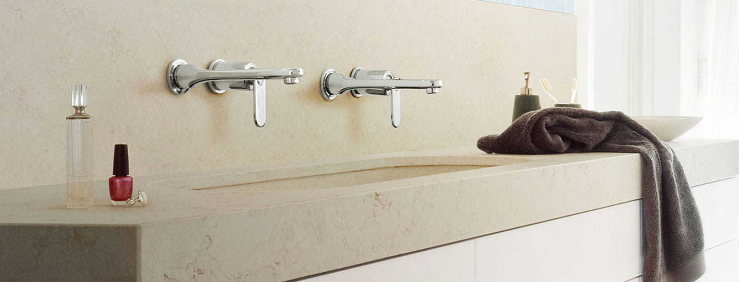 two sinks in bathroom with towel on counter