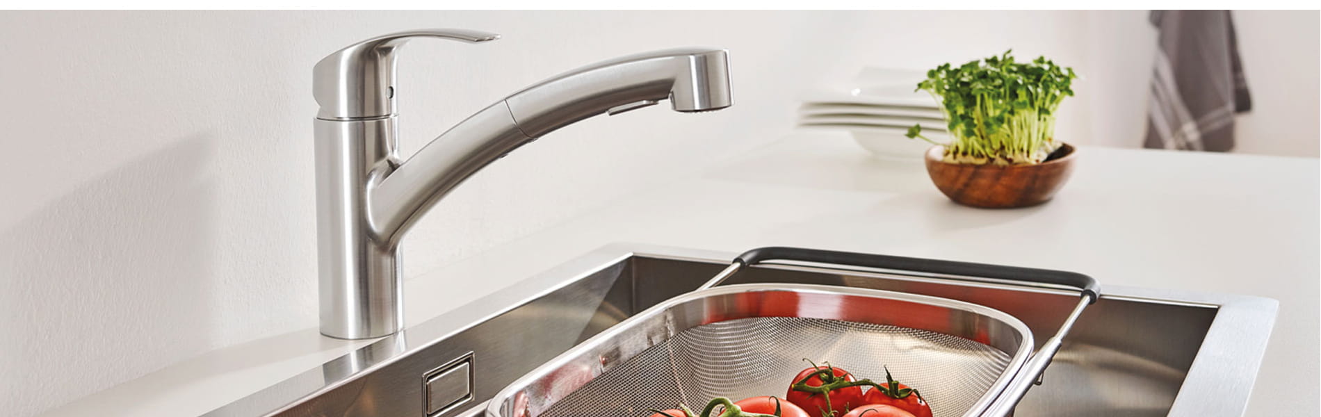 Eurosmart kitchen facet being used to clean vegetables.