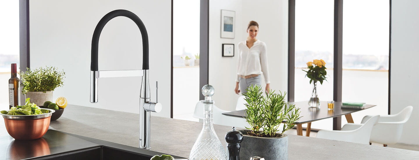 GROHE Essence Kitchen Faucet in Kitchen Scene with Woman in Background