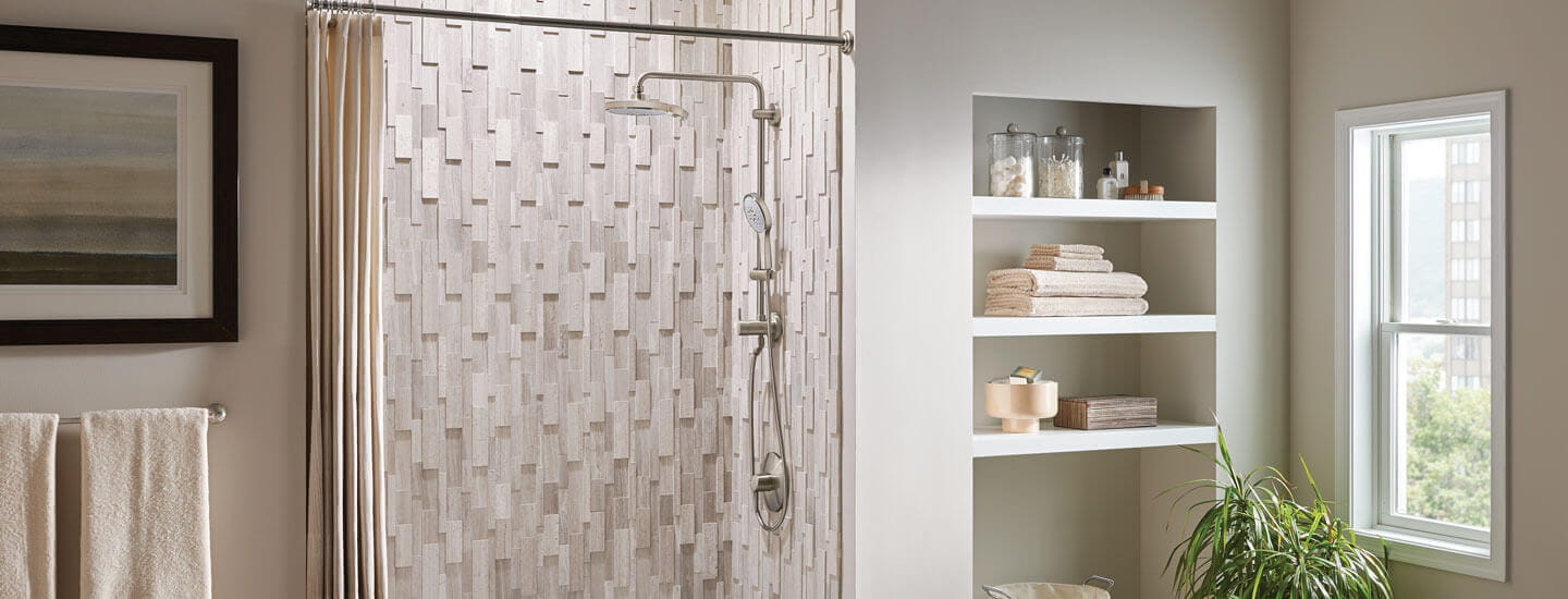 Retro-fit shower set in a bathroom display with cream and light grey accents. 