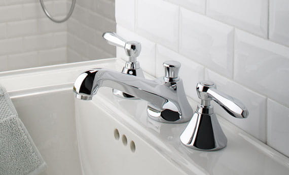 sink and faucet with white tile background