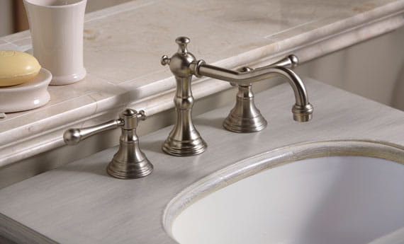 faucet and sink with marble countertop