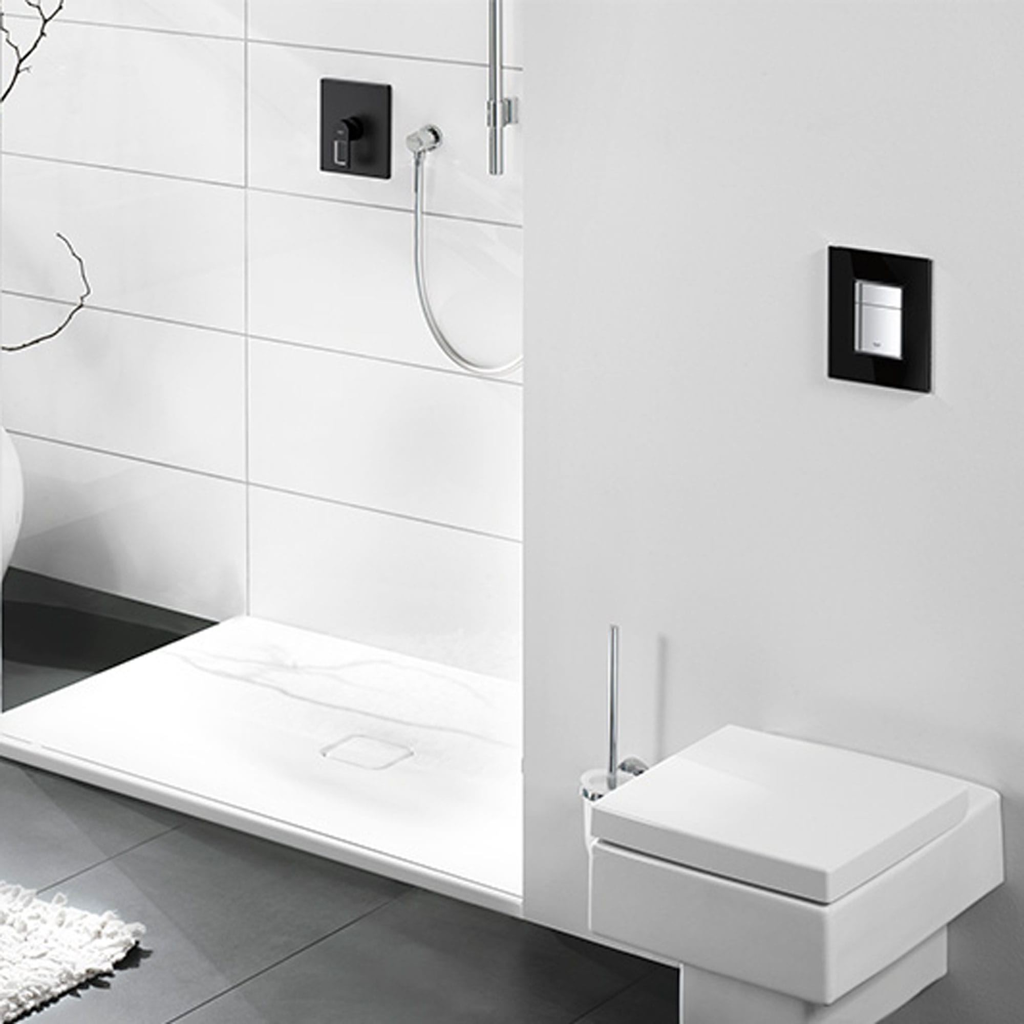 Square flush plate in a grey bathroom.