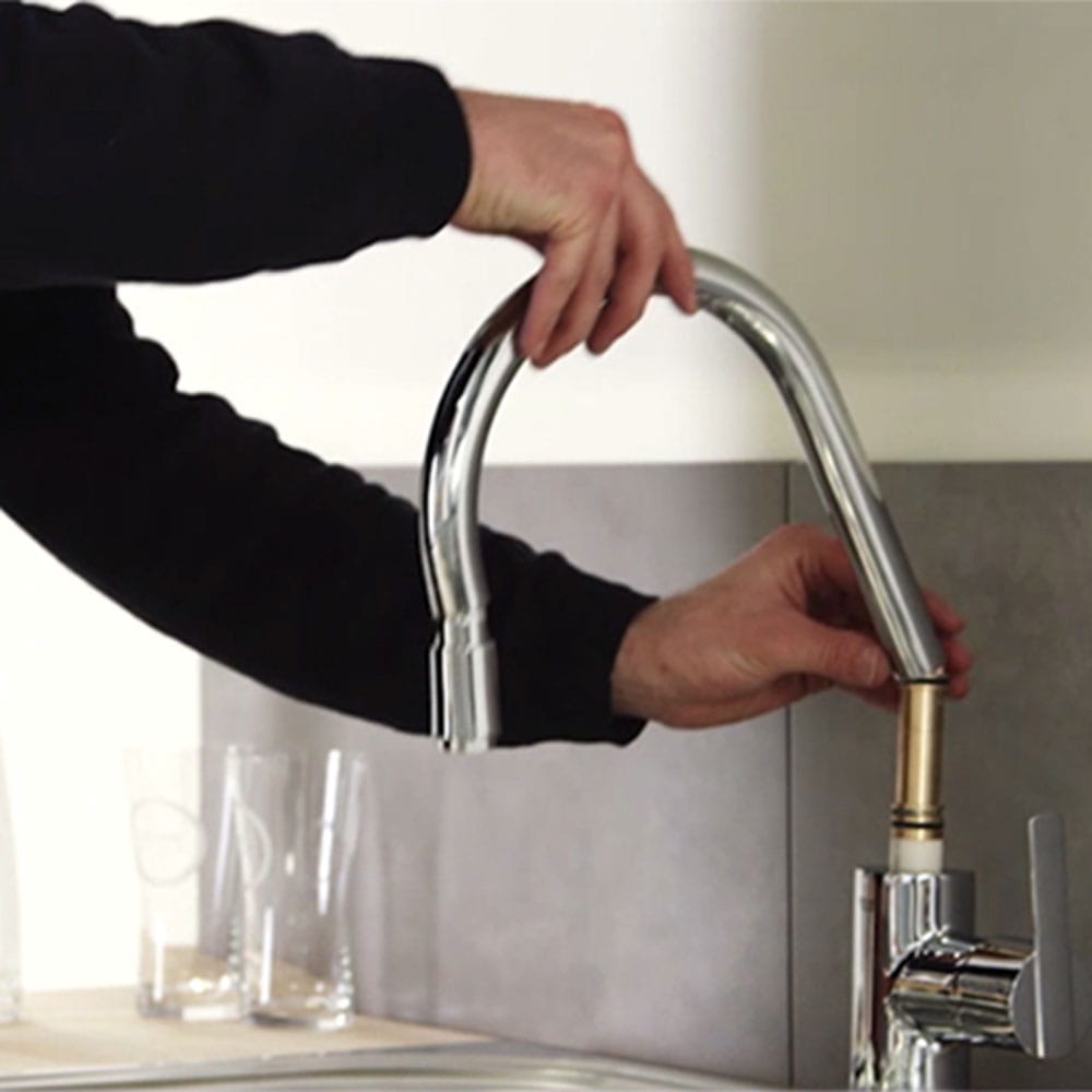Install a kitchen faucet with pull-out spout