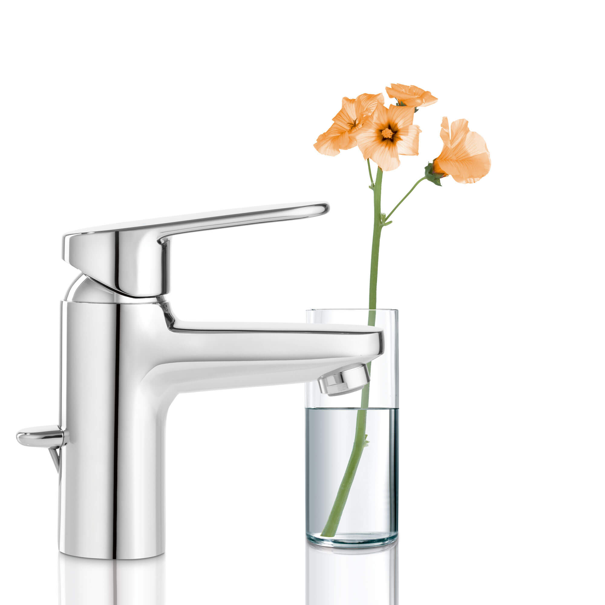 Europlus bathroom faucet next to a glass filled with flowers.