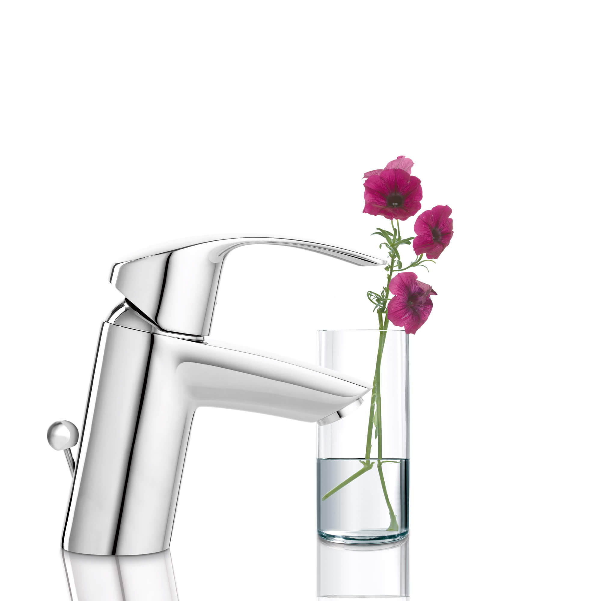 Eurosmart faucet pictured next to a glass filled with flowers.