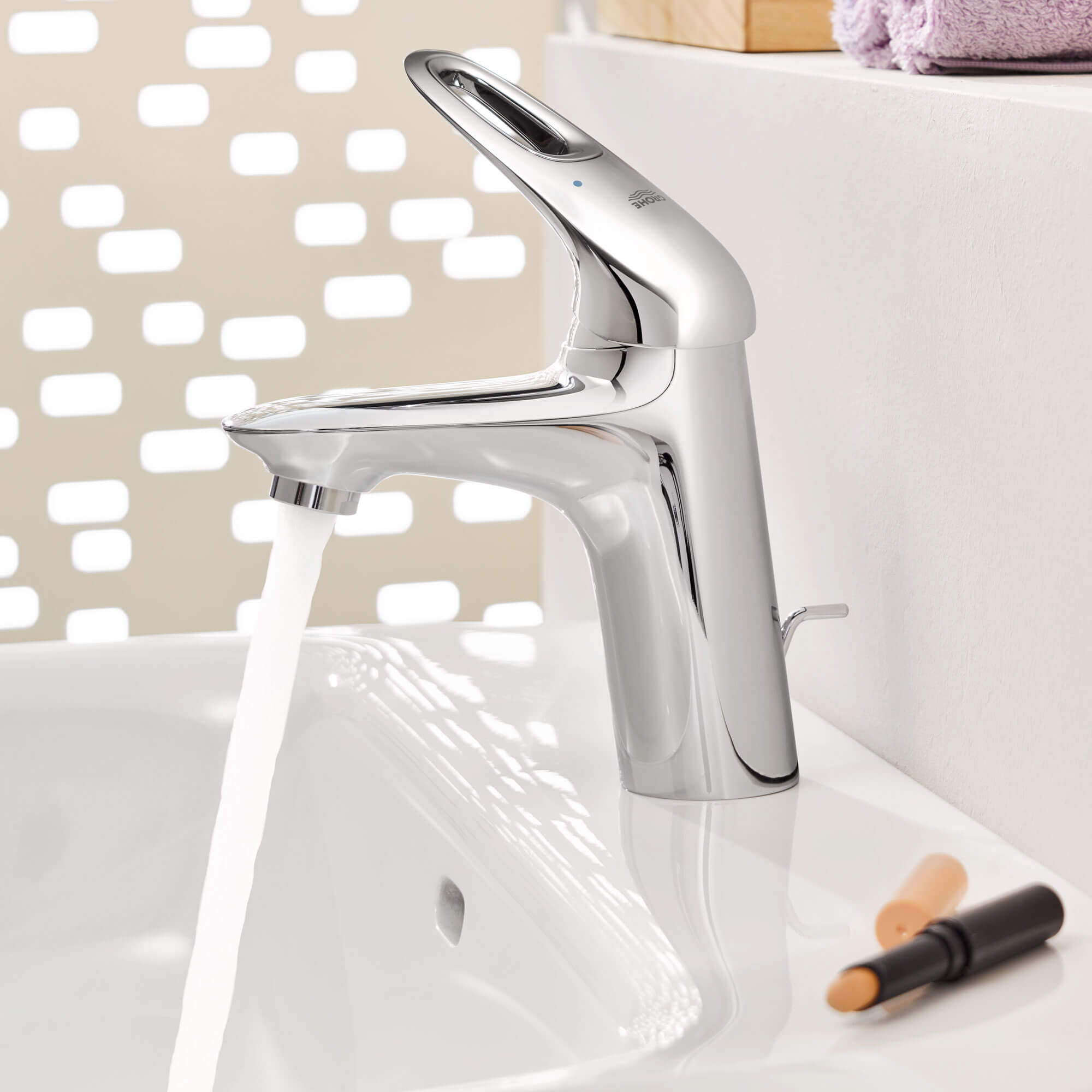 Eurostyle bathroom faucet with a white speckled background. 