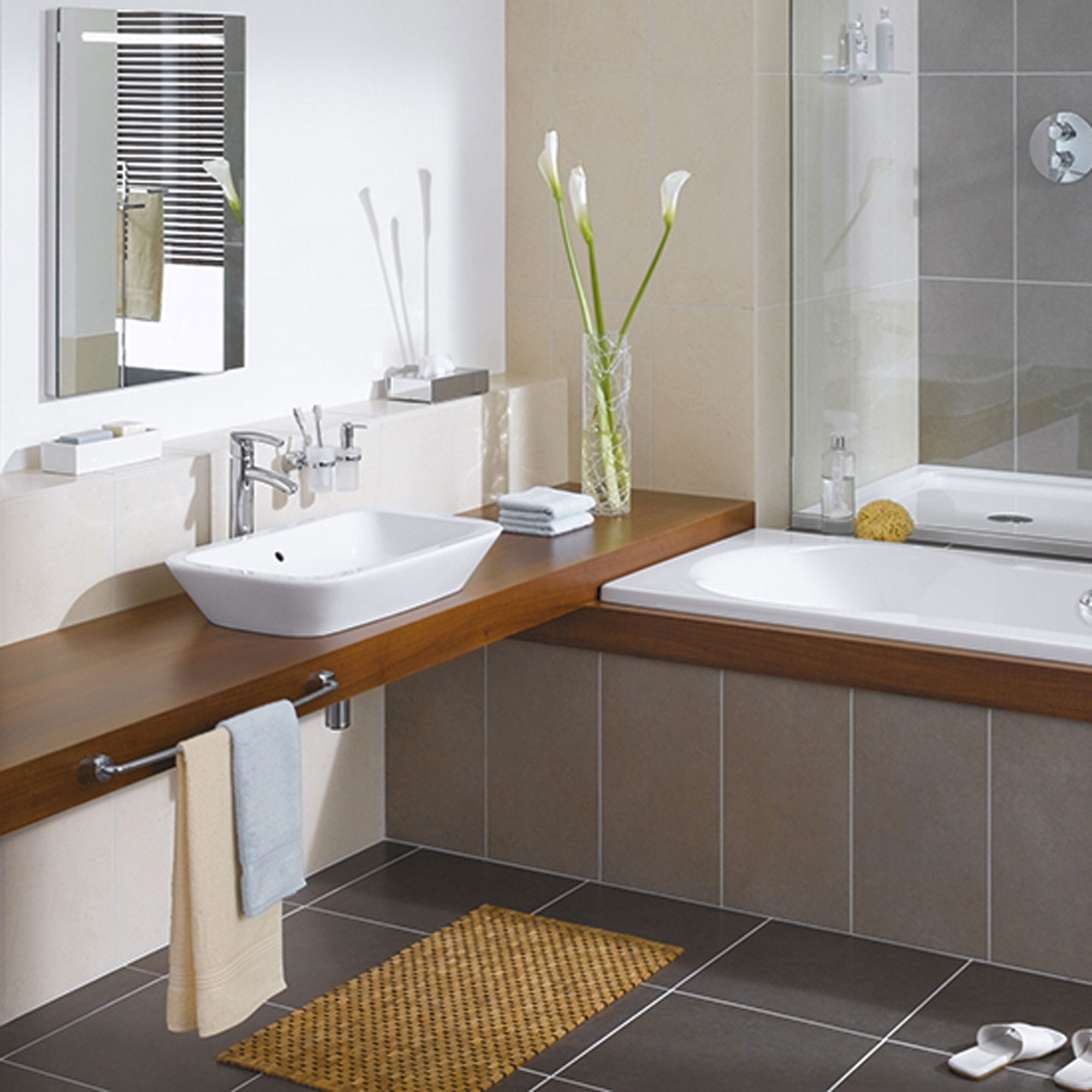 Bathroom with wooden counter top with bathtub on the side