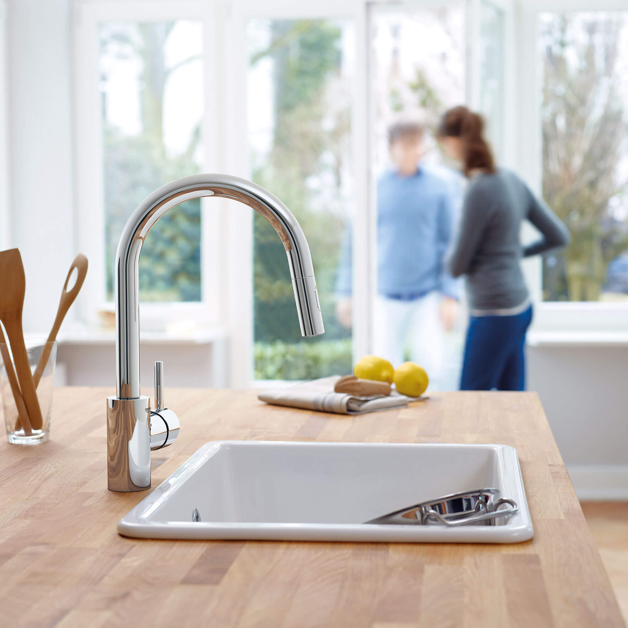 Concetta Kitchen Faucet in Kitchen with People Opening a Door