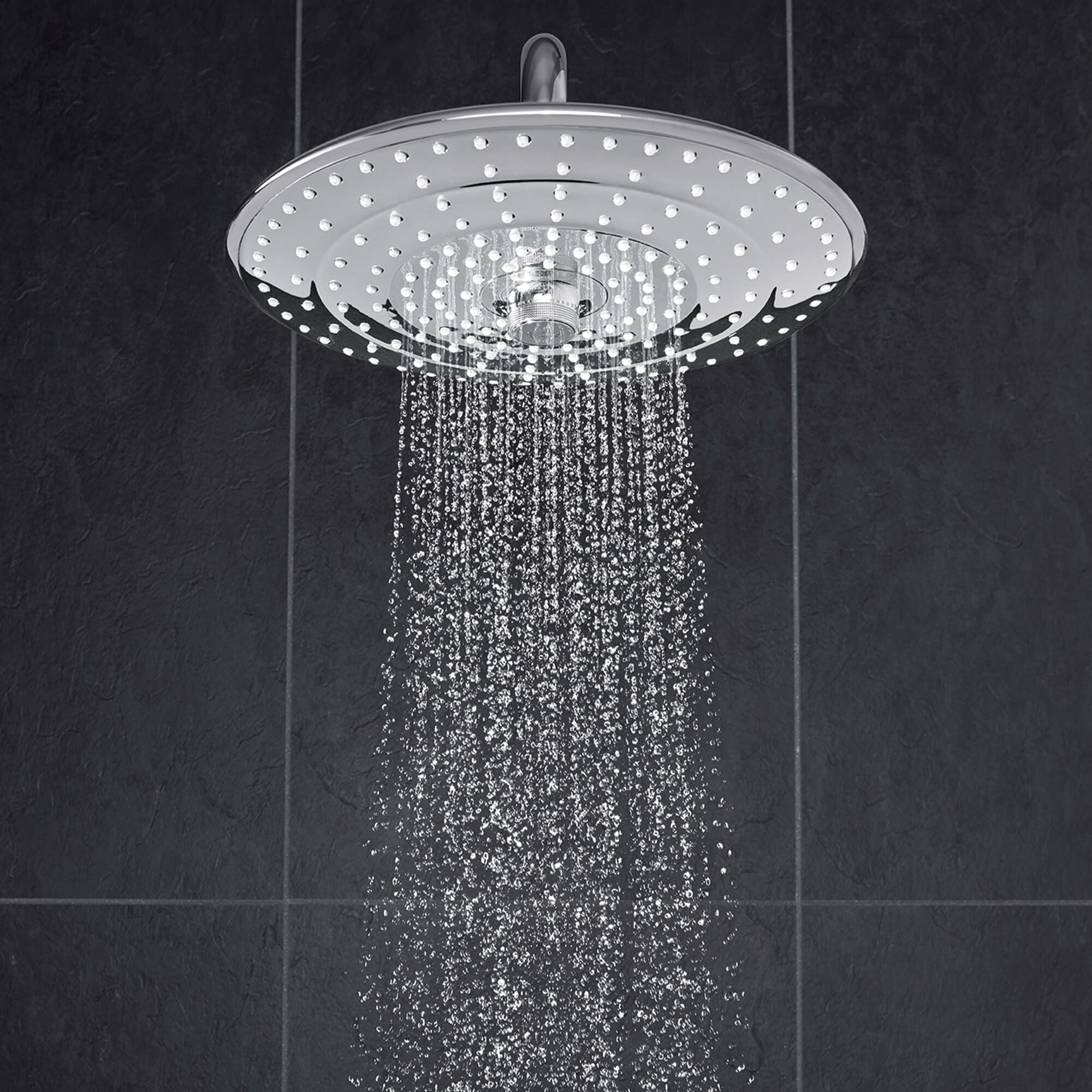 running rain shower from round showerhead