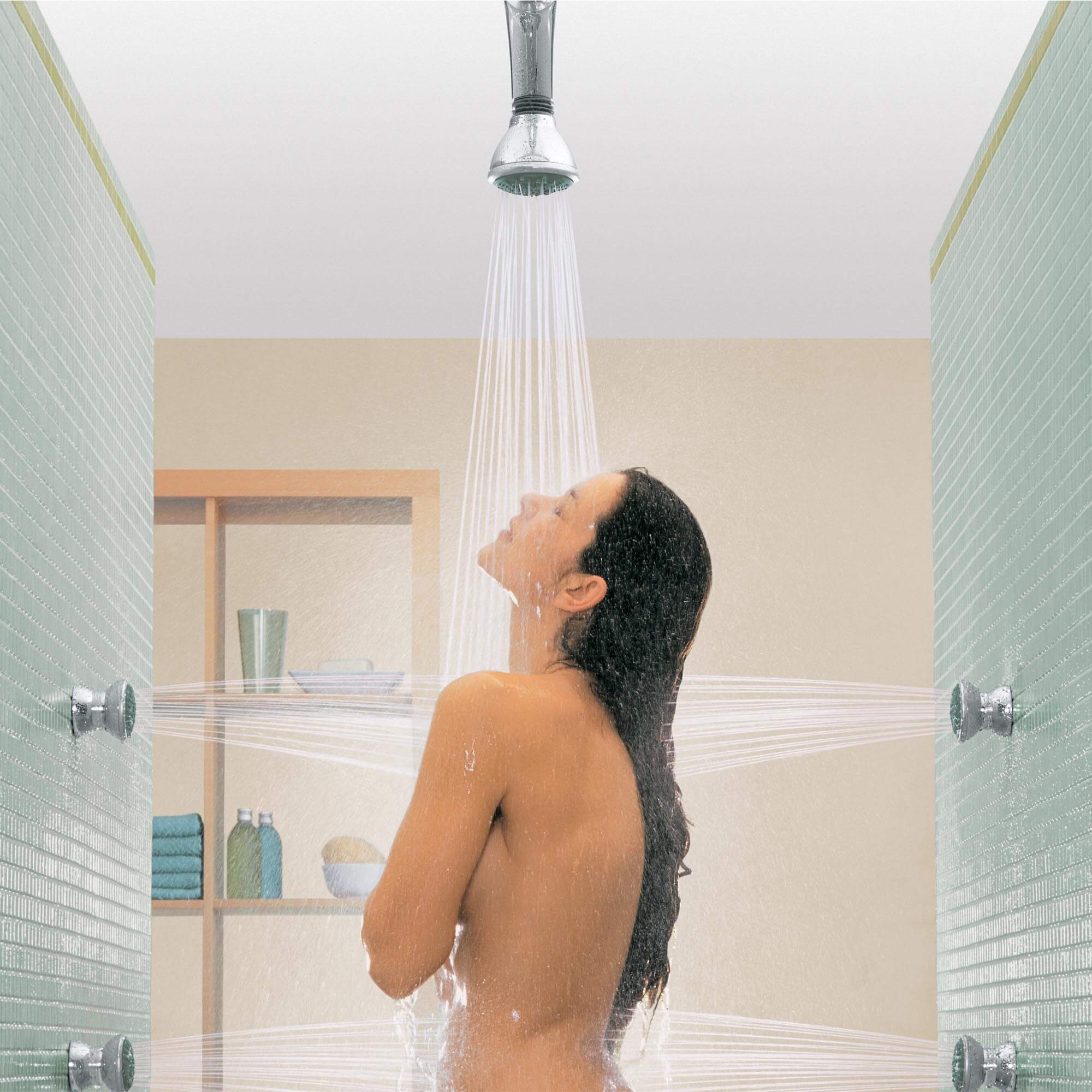 Movario Shower Collection - Woman in shower using ceiling showerhead and wall jet sprays