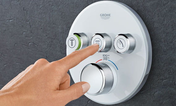 Grohe Smartherm with a person pushing the buttons