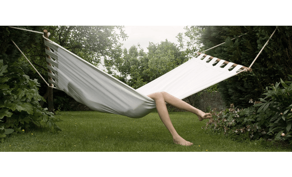 person relaxing in hamock