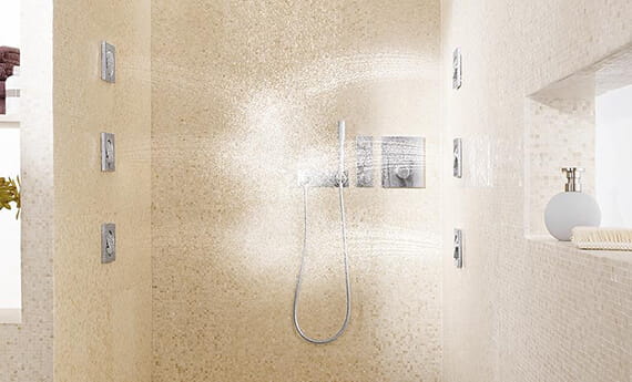 Bathroom with multiple shower jet sprays from the walls
